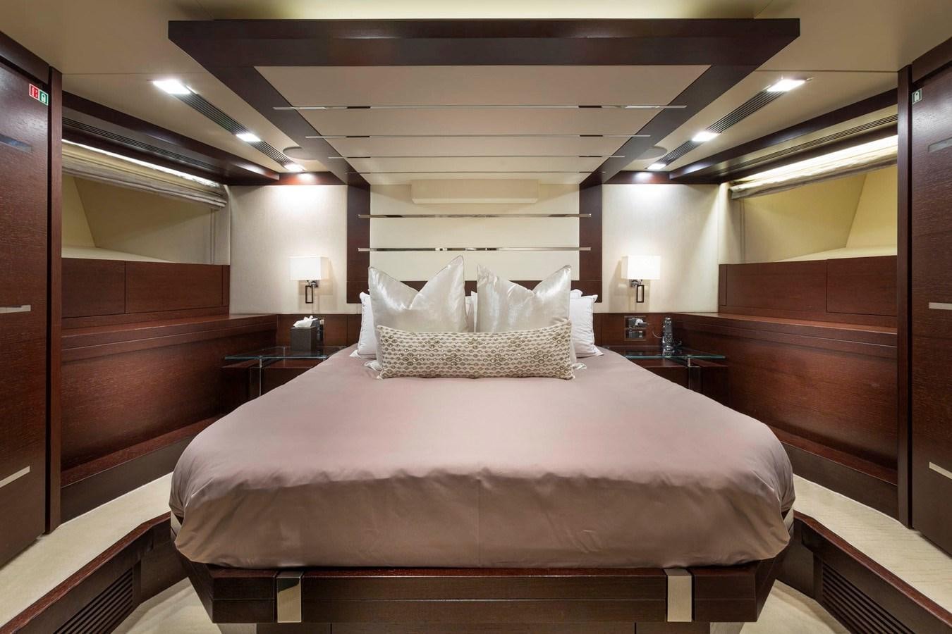 a bed in a room aboard INSIEME Yacht for Sale