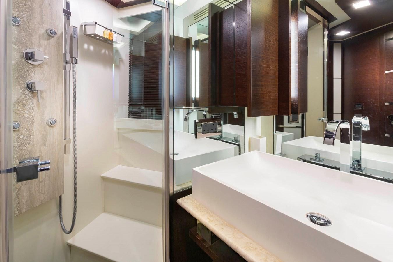 a bathroom with a large mirror aboard INSIEME Yacht for Sale