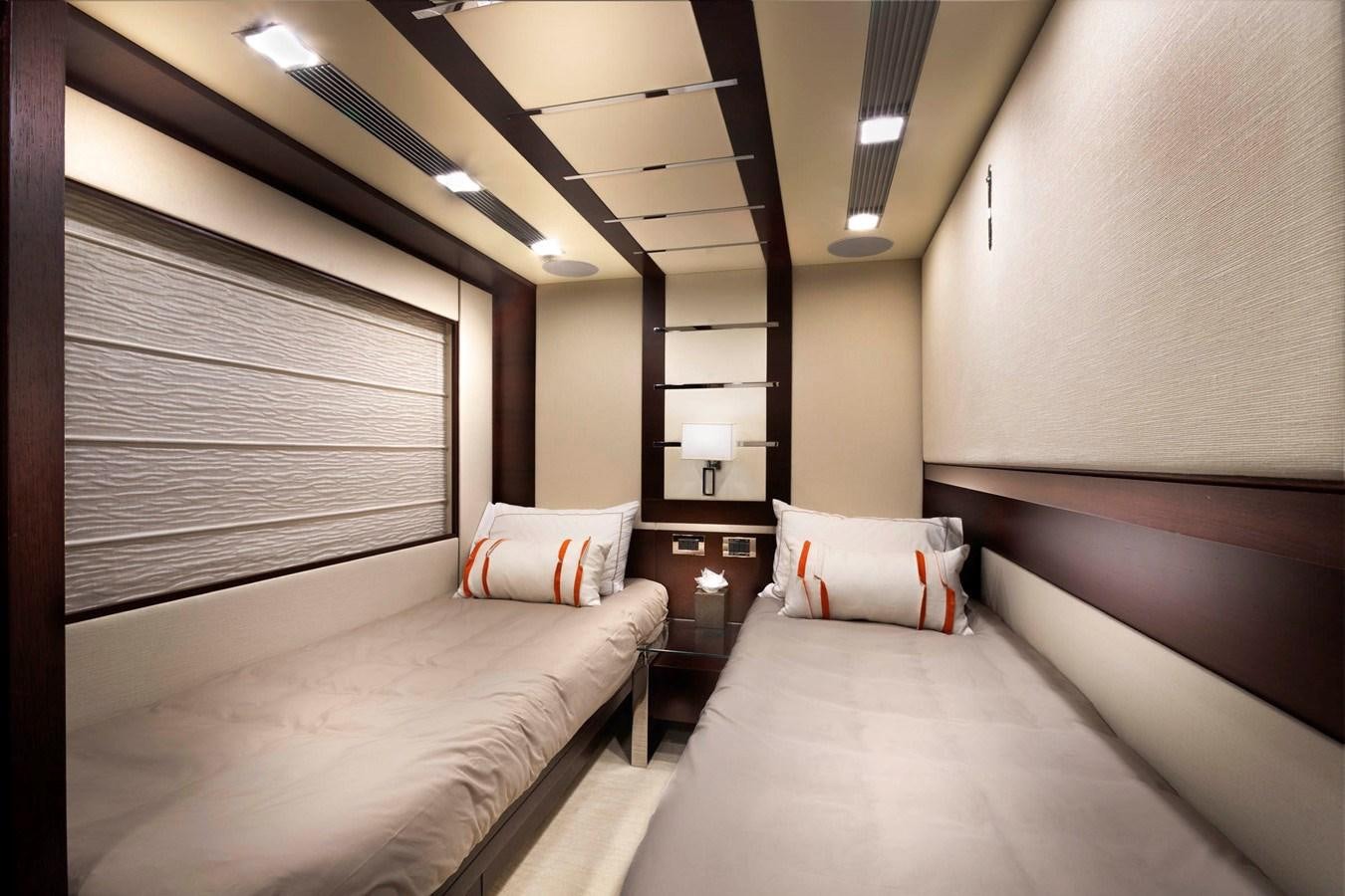 a room with two beds aboard INSIEME Yacht for Sale