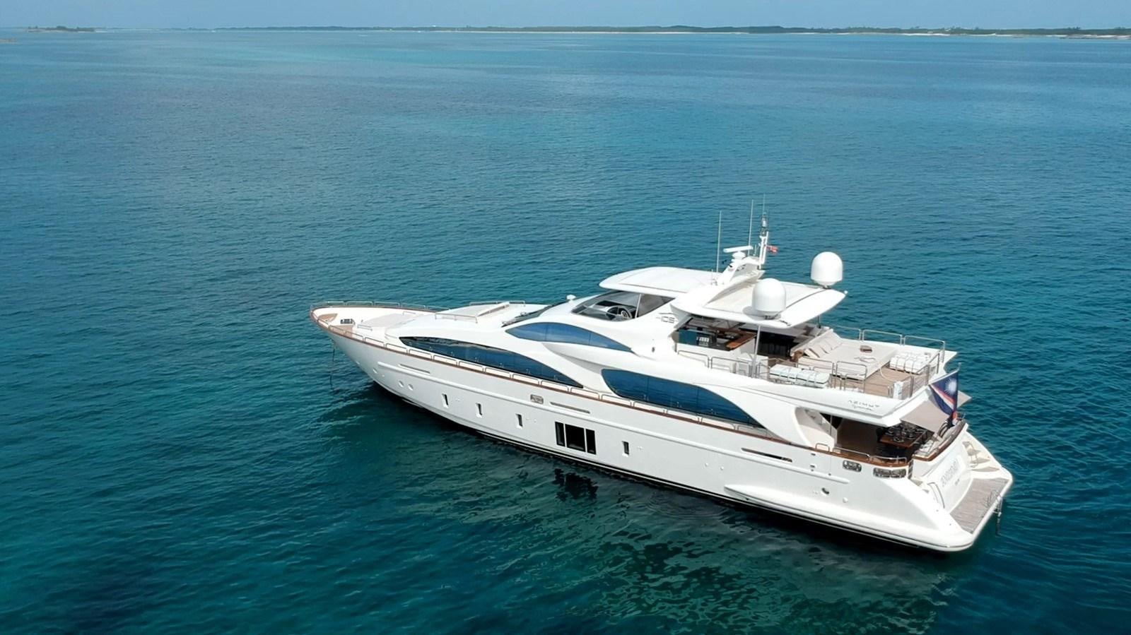 a white yacht in the water aboard INSIEME Yacht for Sale
