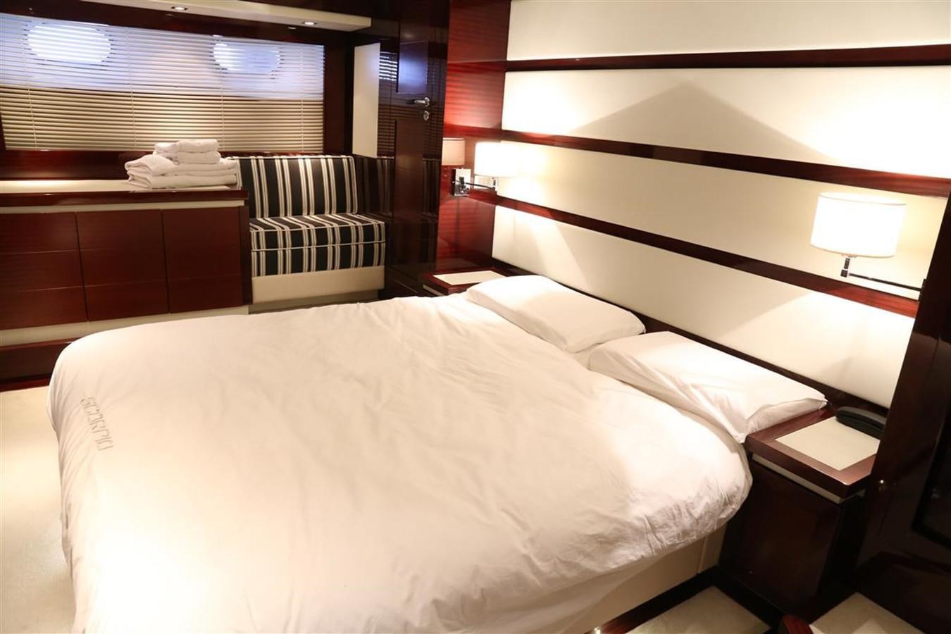 a bed with a white sheet aboard AMER 86 Yacht for Sale