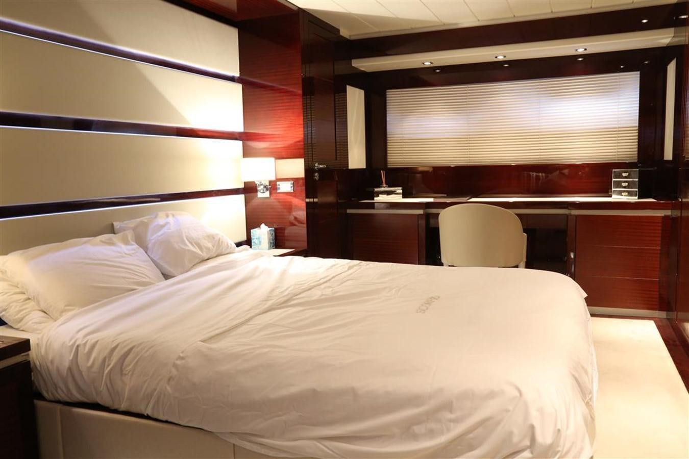 a bed with white sheets aboard AMER 86 Yacht for Sale