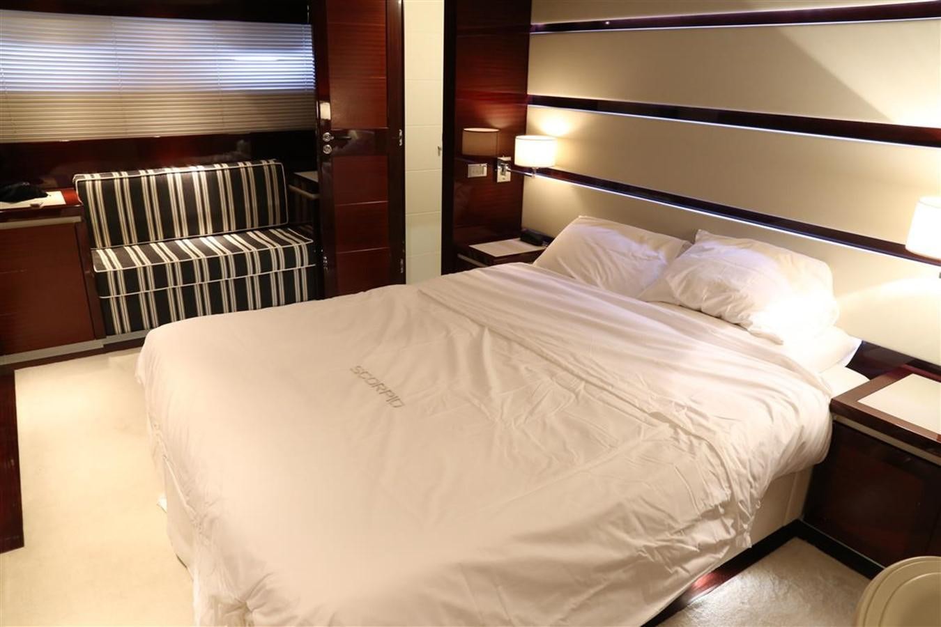 a bed with white sheets aboard AMER 86 Yacht for Sale