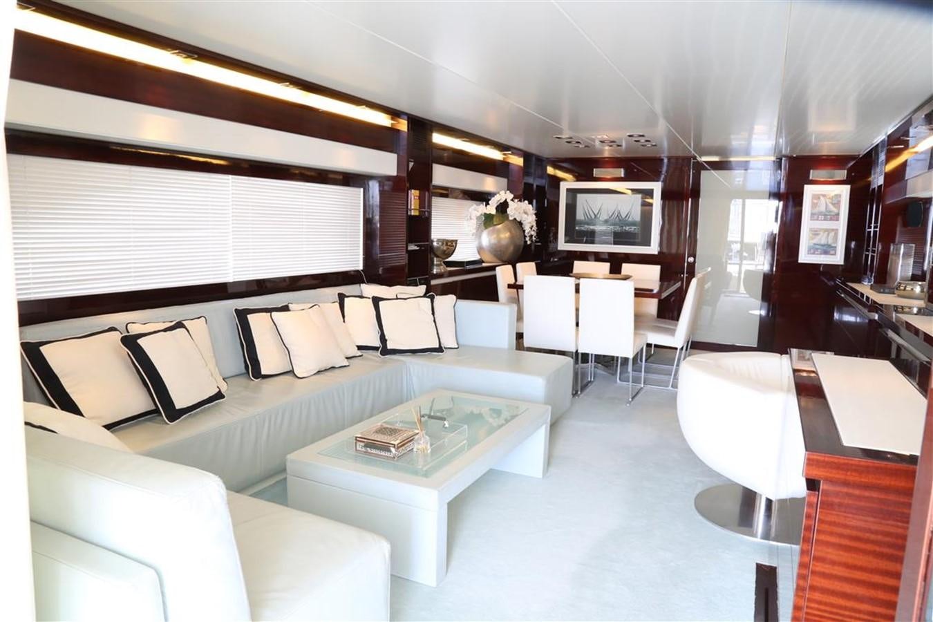 a room with a couch and a table aboard AMER 86 Yacht for Sale