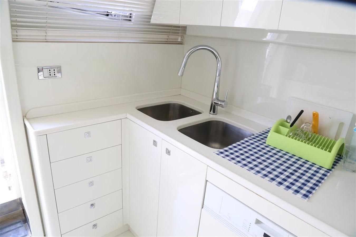 a kitchen with a sink and a countertop aboard AMER 86 Yacht for Sale