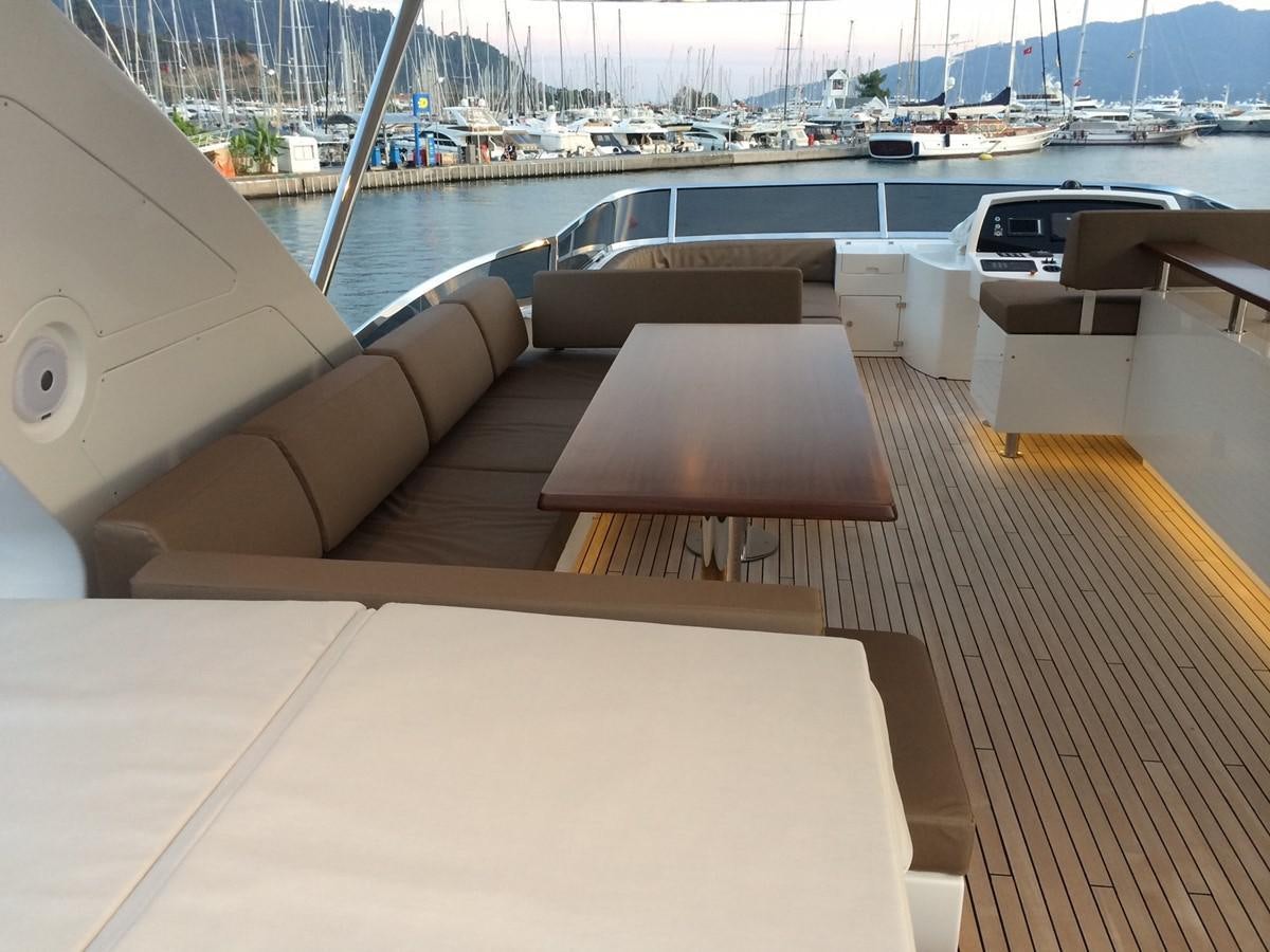 a deck with a view of a marina and boats aboard AZ84 Yacht for Sale