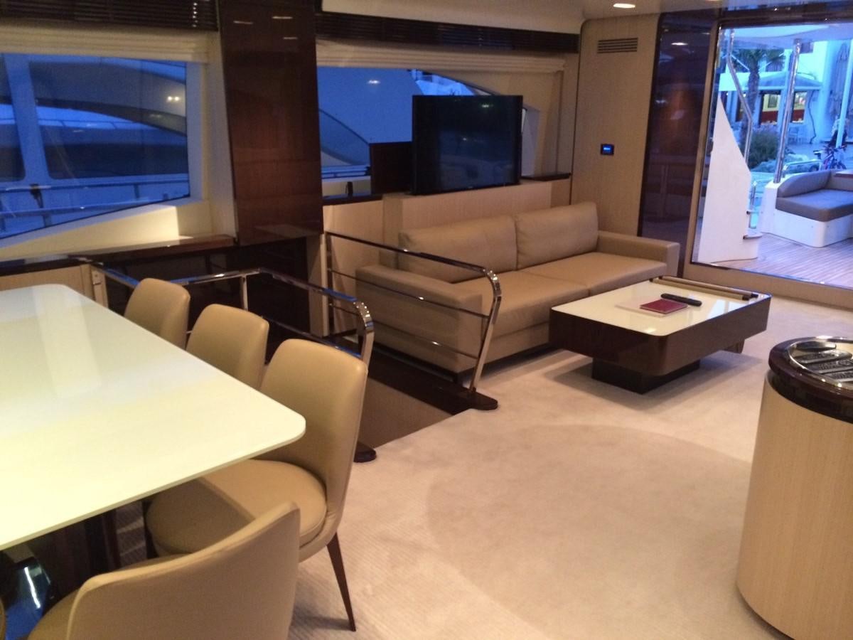 a living room with a couch and a tv aboard AZ84 Yacht for Sale