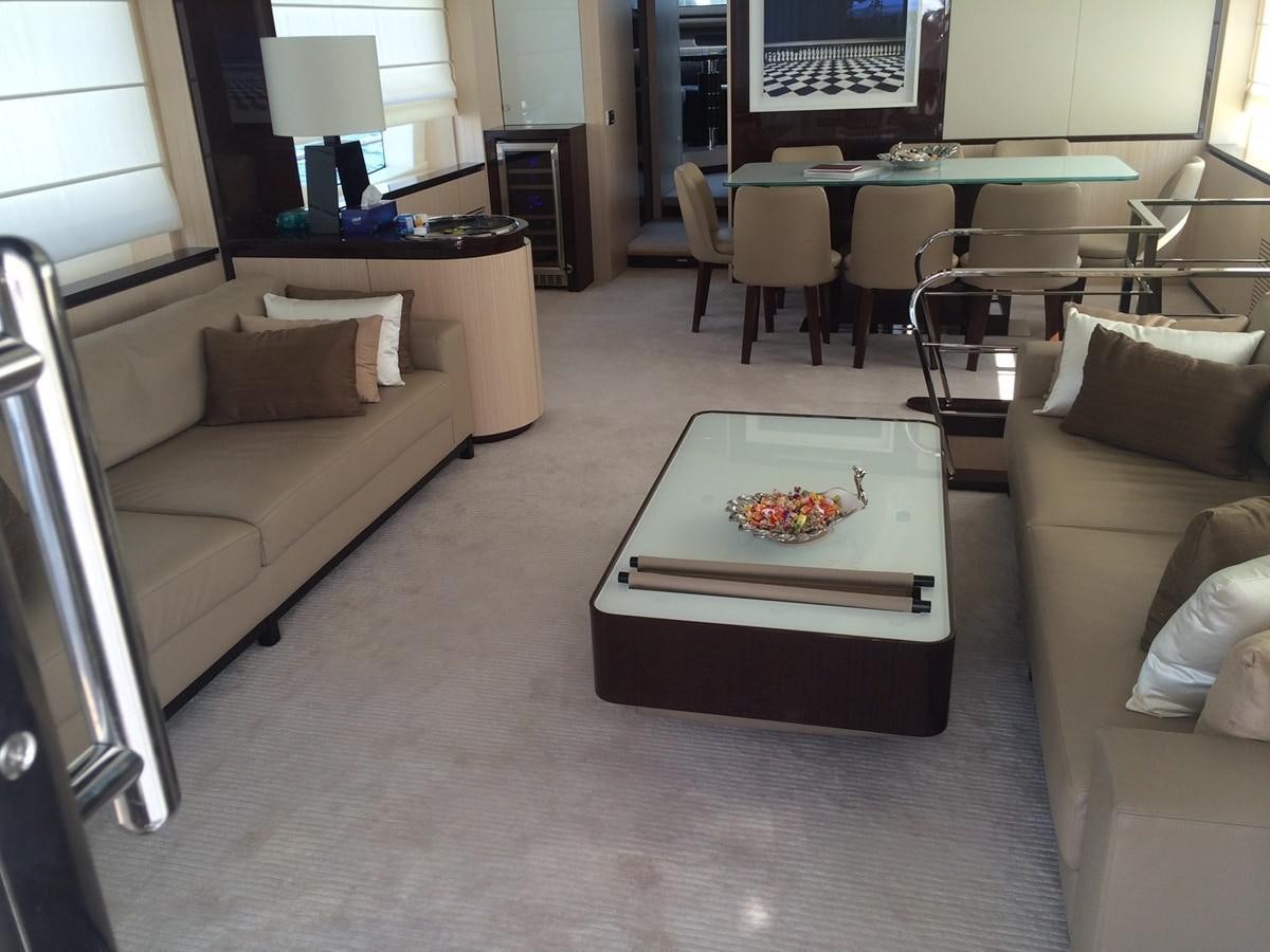 a living room with a couch and a table aboard AZ84 Yacht for Sale