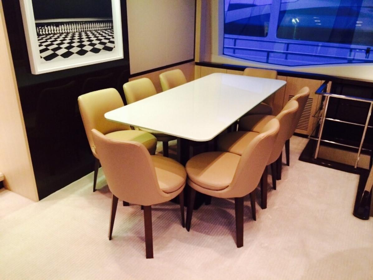 a table with chairs around it aboard AZ84 Yacht for Sale