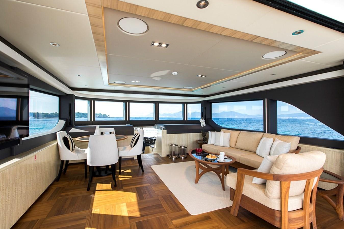 a room with a table and chairs aboard NIXTUN Yacht for Sale