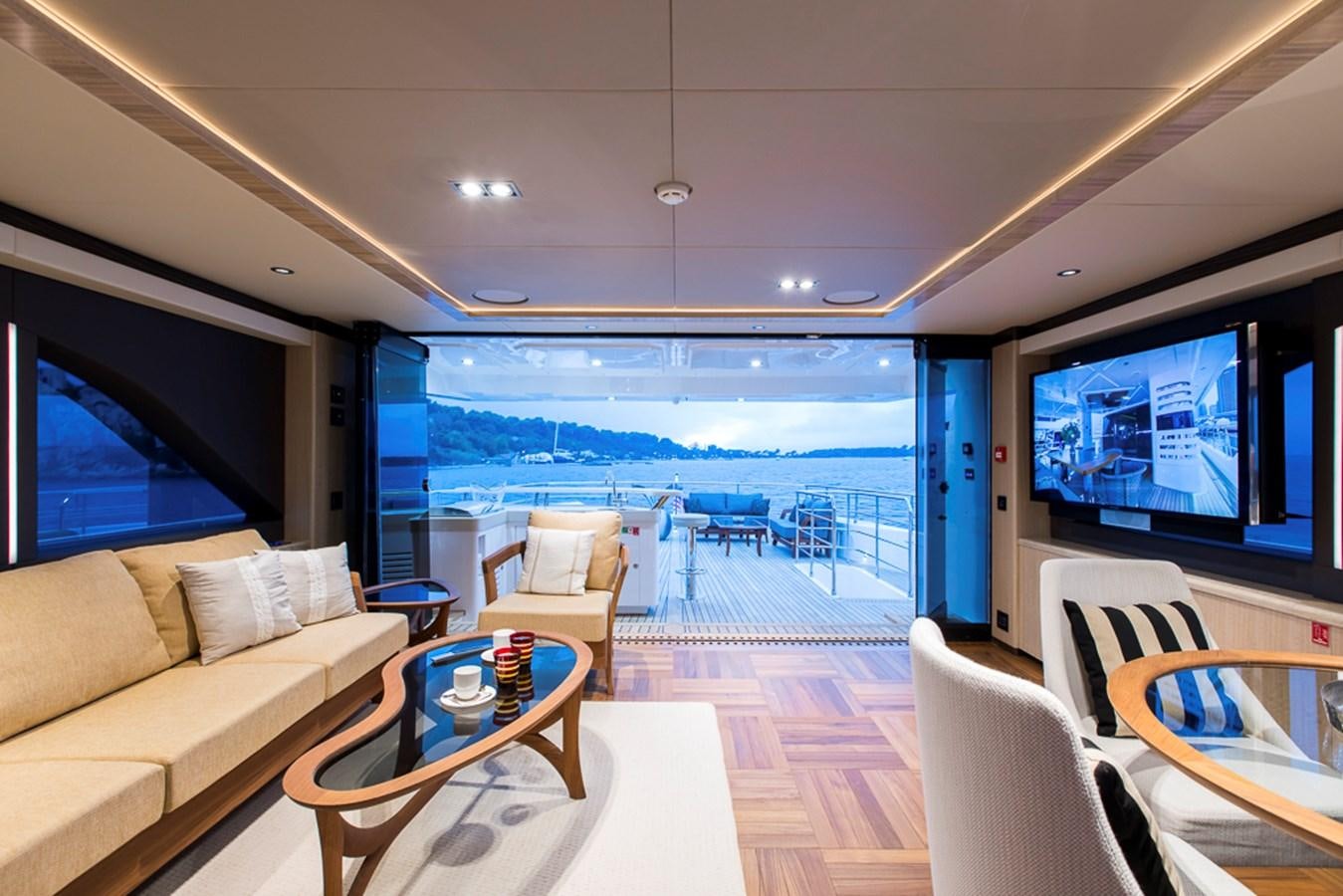 a living room with a large window aboard NIXTUN Yacht for Sale