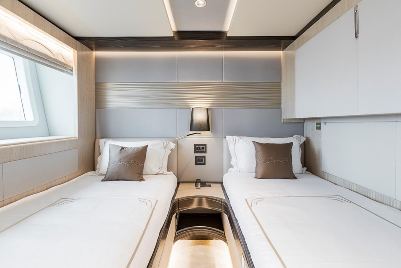 a couple of beds in a room aboard NIXTUN Yacht for Sale