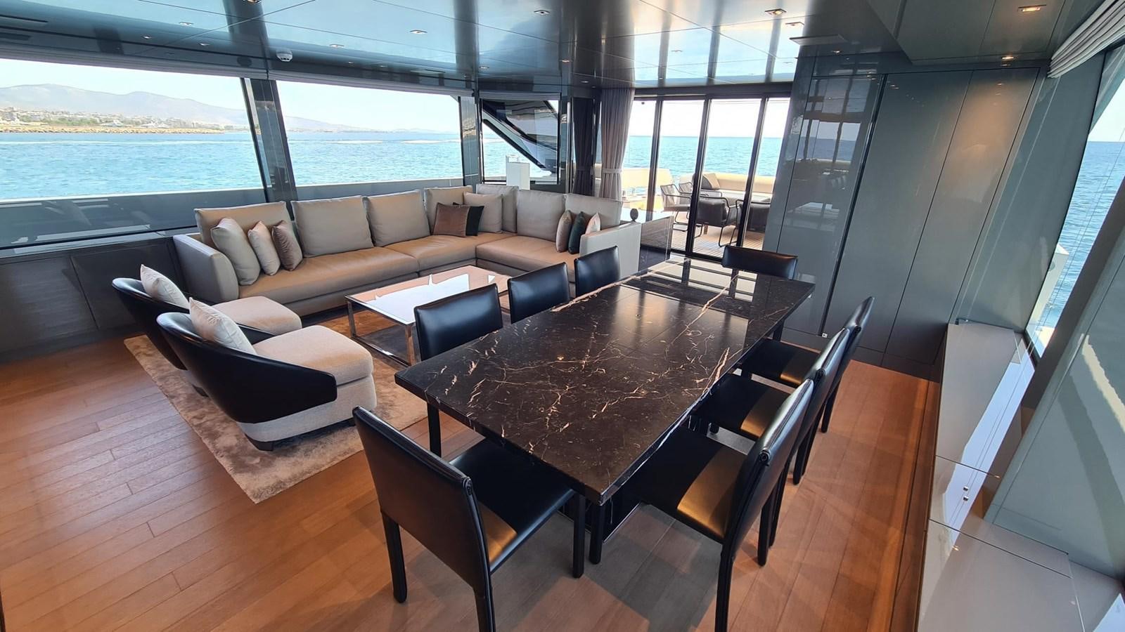 a living room with a large window aboard 2021 SANLORENZO SD96 #95 Yacht for Sale