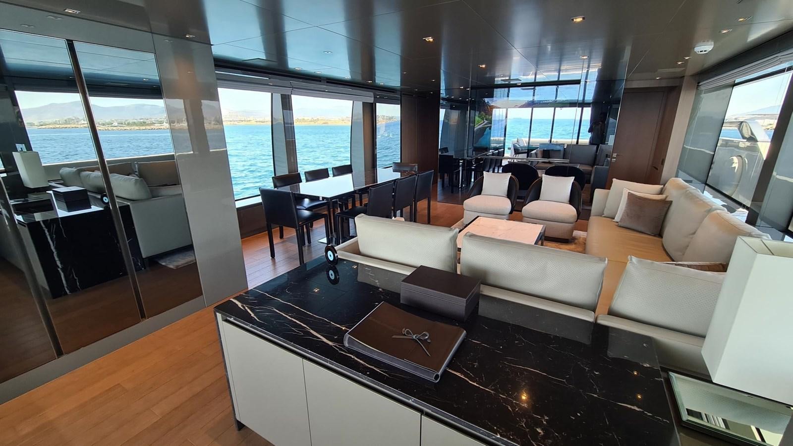 a room with a couch and a table aboard 2021 SANLORENZO SD96 #95 Yacht for Sale