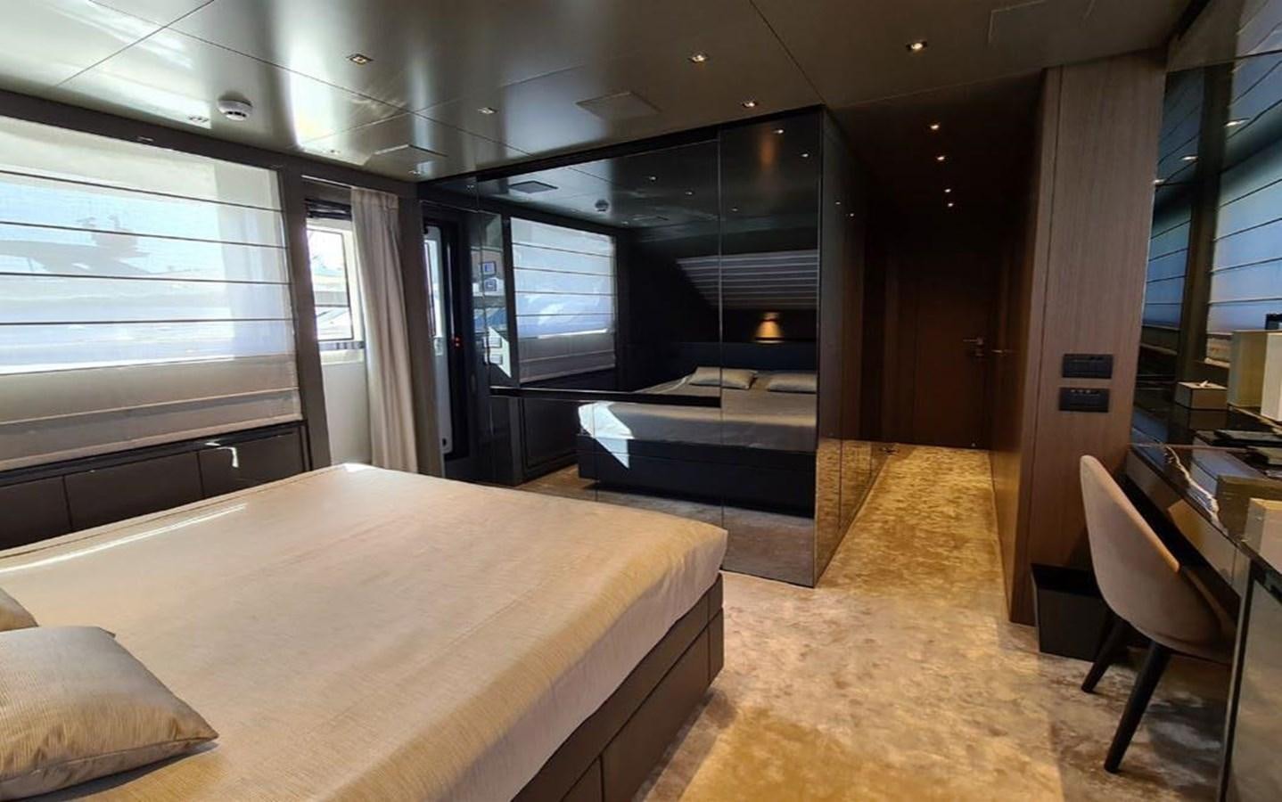 a room with a bed and a table aboard 2021 SANLORENZO SD96 #95 Yacht for Sale