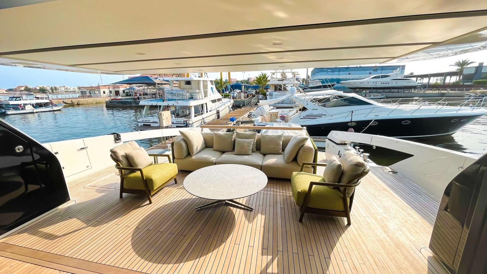 a room with a couch and chairs aboard 2021 SANLORENZO SX88 #47 Yacht for Sale