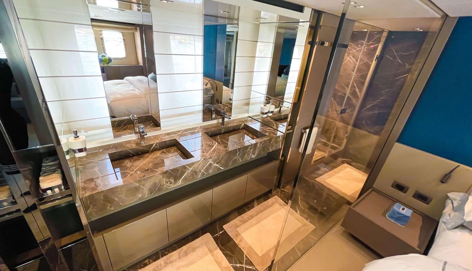 a bathroom with a large glass shower aboard 2021 SANLORENZO SX88 #47 Yacht for Sale