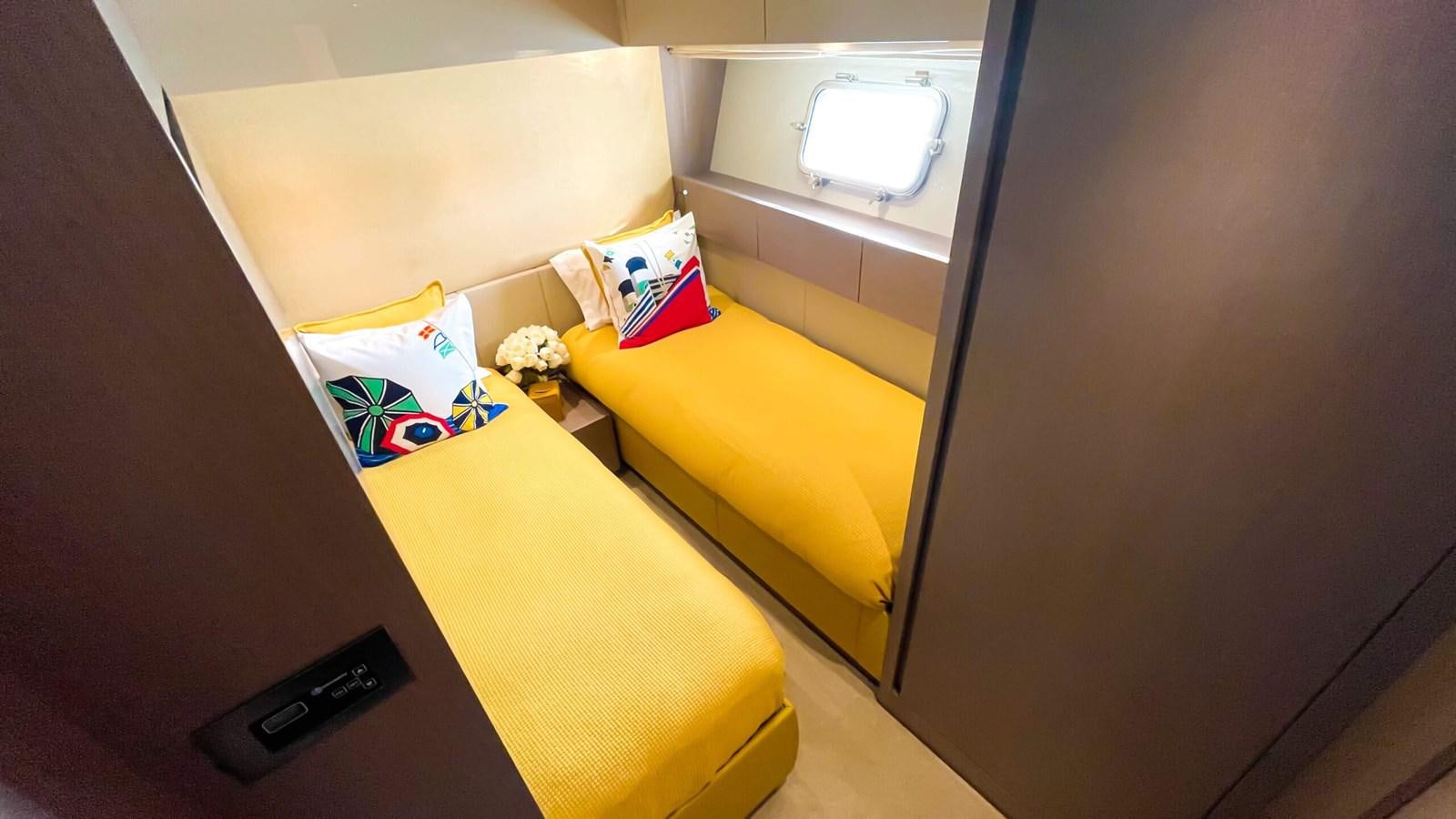 a room with a yellow desk and a window aboard 2021 SANLORENZO SX88 #47 Yacht for Sale