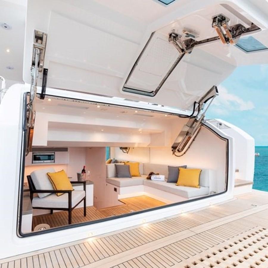 a modern looking room with a glass ceiling and a white ceiling aboard ONE MORE TIME Yacht for Sale