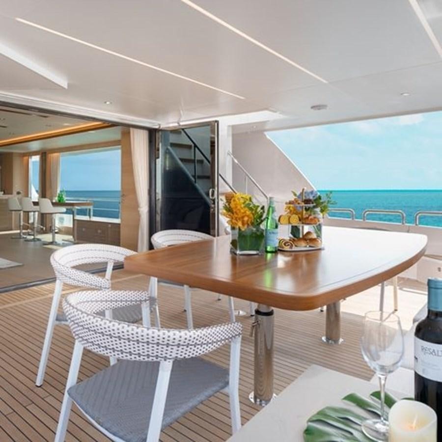 a table with chairs and a table aboard ONE MORE TIME Yacht for Sale