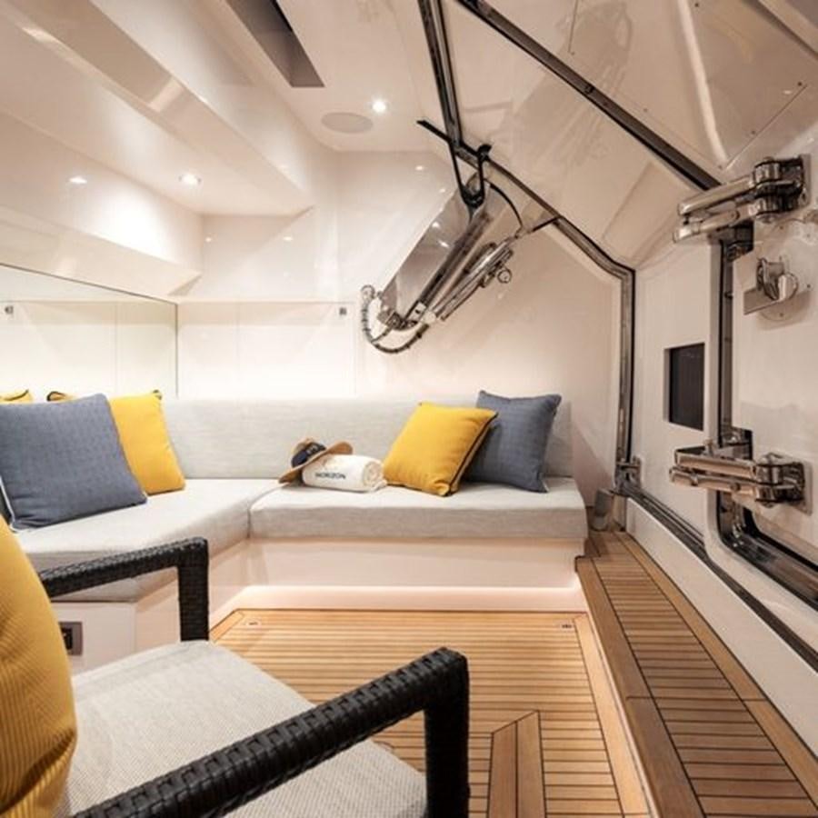 a bedroom with a bed and a desk aboard ONE MORE TIME Yacht for Sale