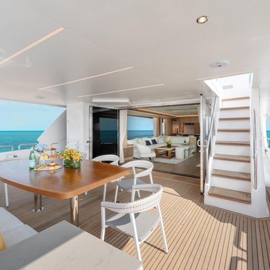 a room with a table chairs and a ladder aboard ONE MORE TIME Yacht for Sale