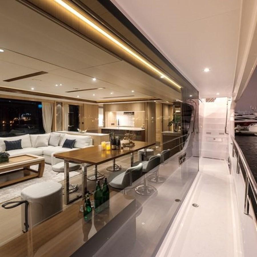 a room with a table and chairs aboard ONE MORE TIME Yacht for Sale