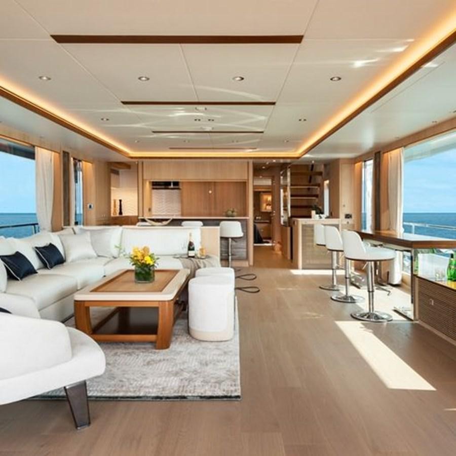 a living room with a large open window aboard ONE MORE TIME Yacht for Sale
