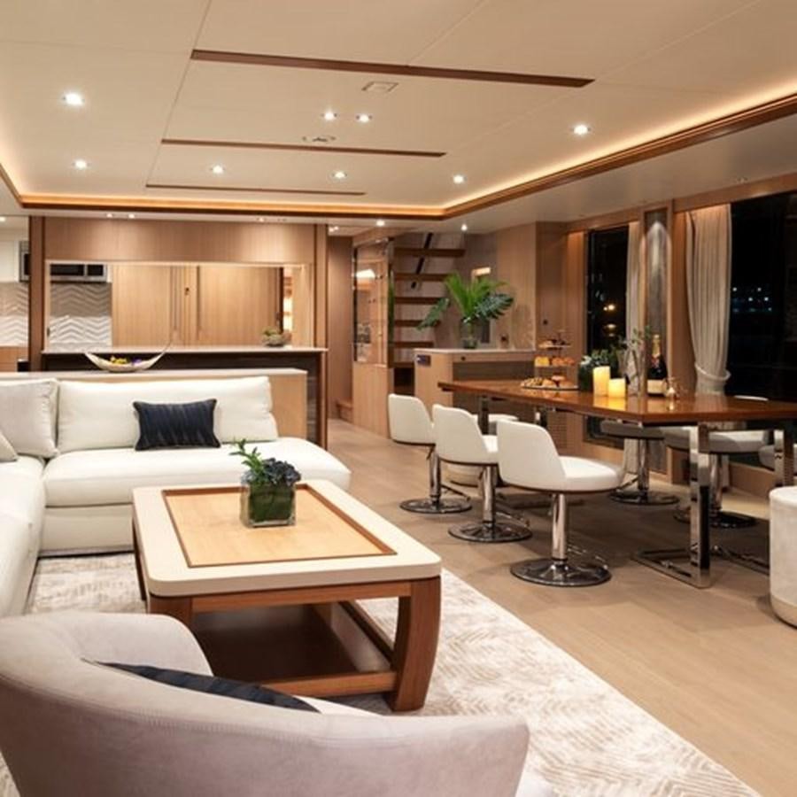 a living room with a couch and a table aboard ONE MORE TIME Yacht for Sale