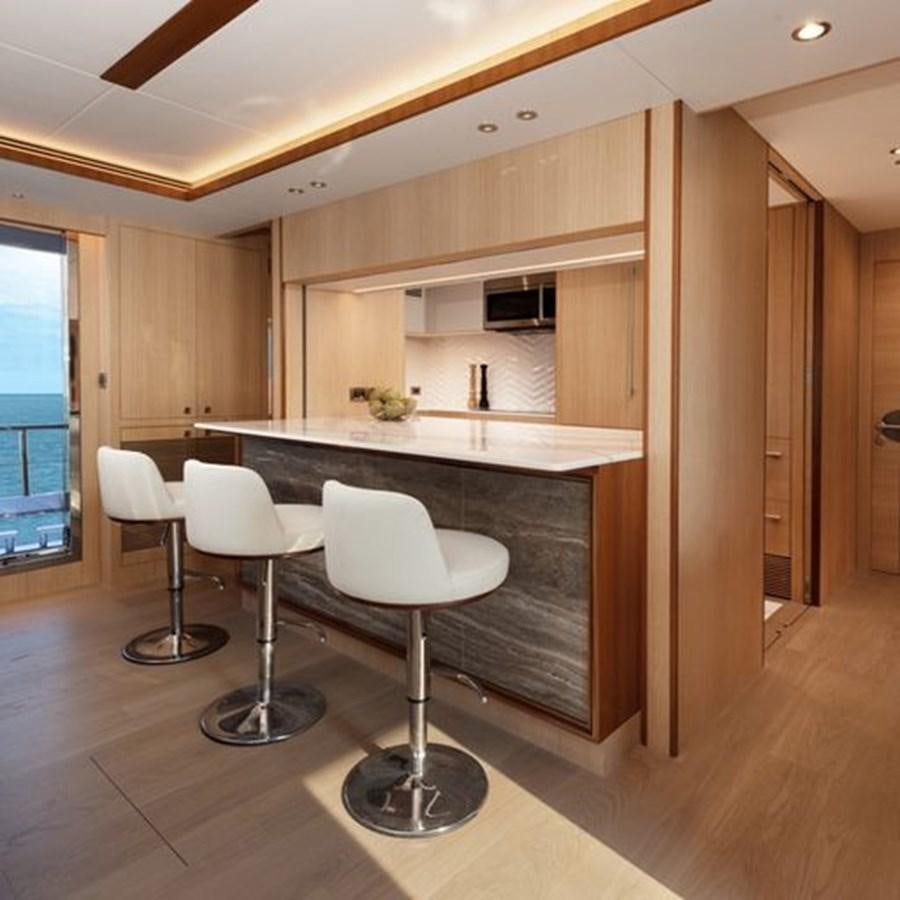 a kitchen with a table and chairs aboard ONE MORE TIME Yacht for Sale