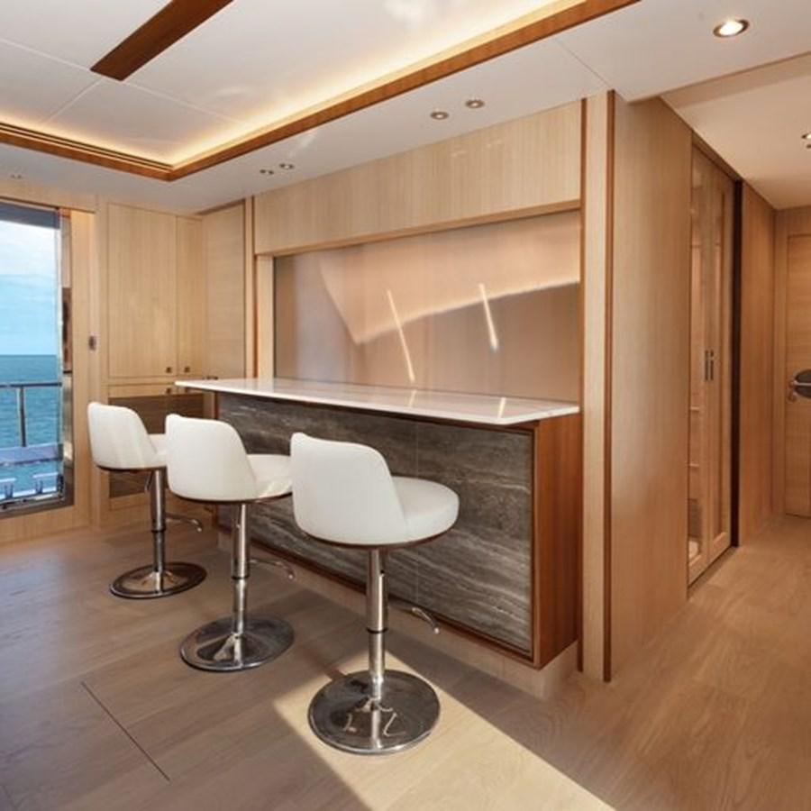 a room with a table and chairs aboard ONE MORE TIME Yacht for Sale