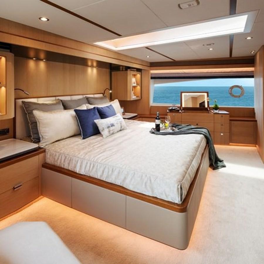 a bed in a room aboard ONE MORE TIME Yacht for Sale