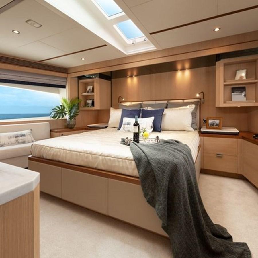 a bed in a room aboard ONE MORE TIME Yacht for Sale