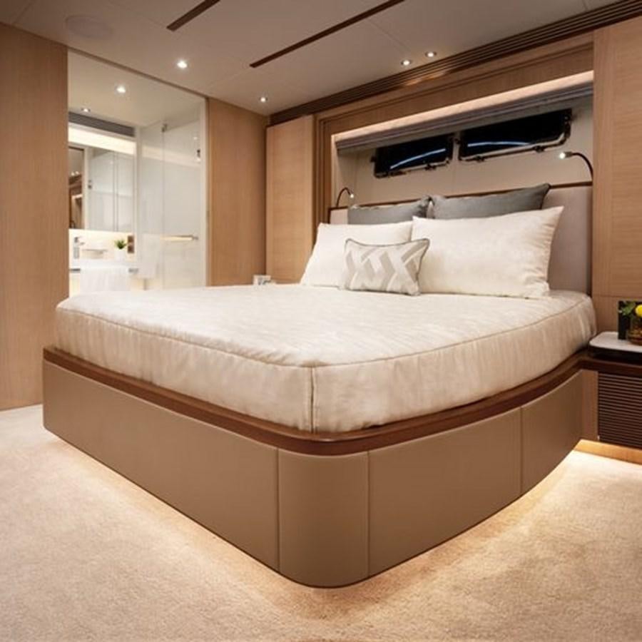 a bed with white sheets aboard ONE MORE TIME Yacht for Sale