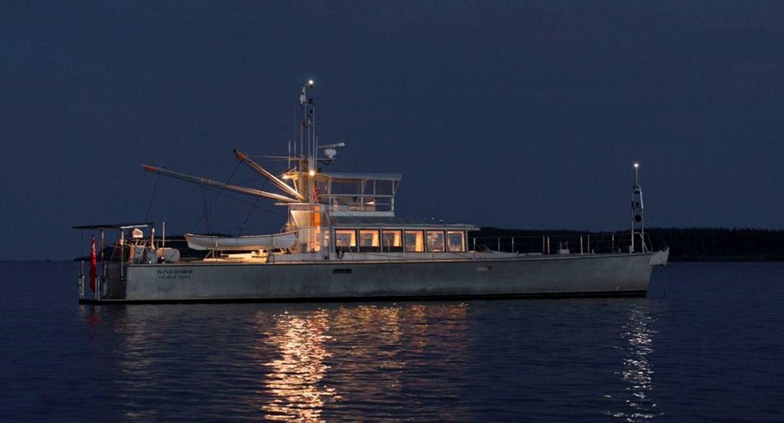 a large boat on the water aboard WIND HORSE Yacht for Sale