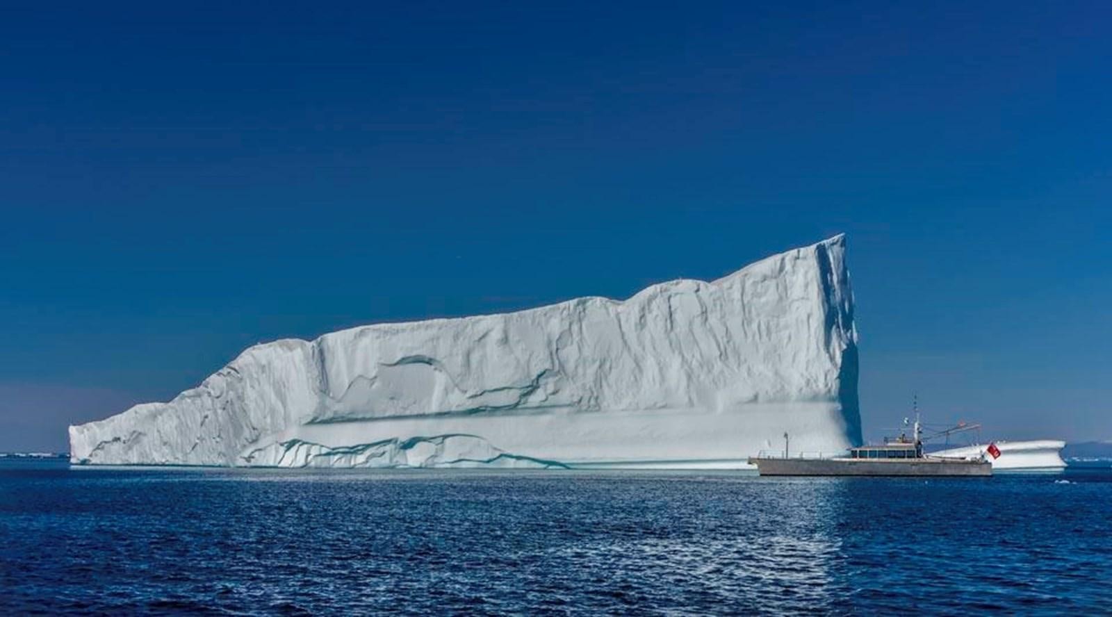 a large iceberg in the ocean aboard WIND HORSE Yacht for Sale