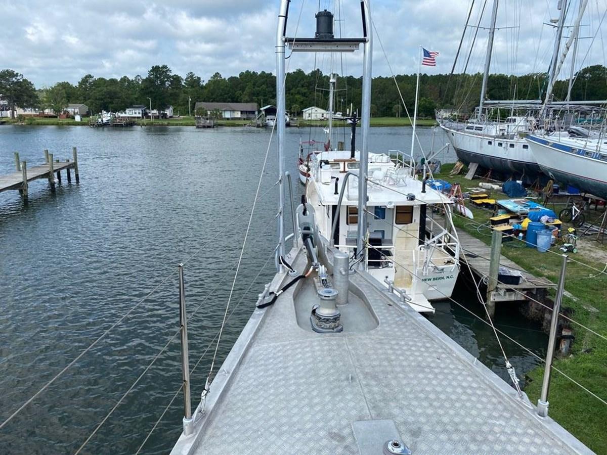a dock with boats aboard WIND HORSE Yacht for Sale
