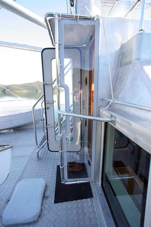 a large white vehicle with metal doors aboard WIND HORSE Yacht for Sale