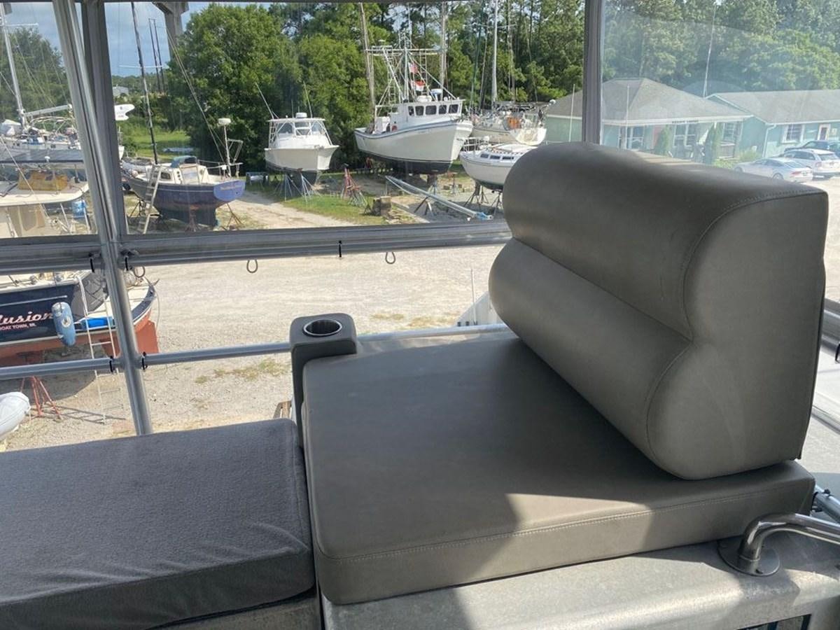 a chair on a porch aboard WIND HORSE Yacht for Sale