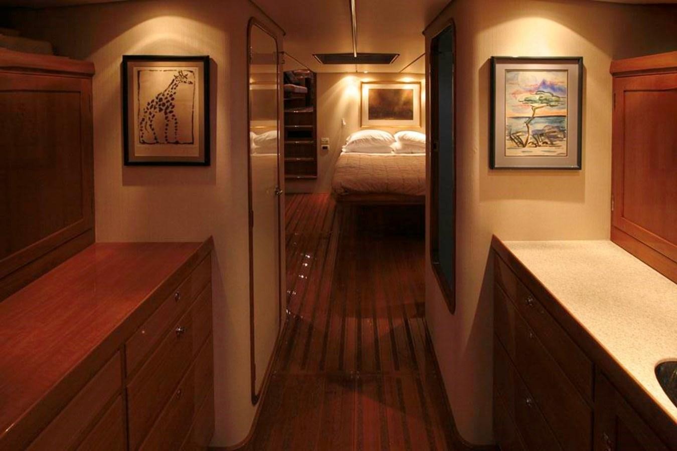 a room with a bed and a desk aboard WIND HORSE Yacht for Sale