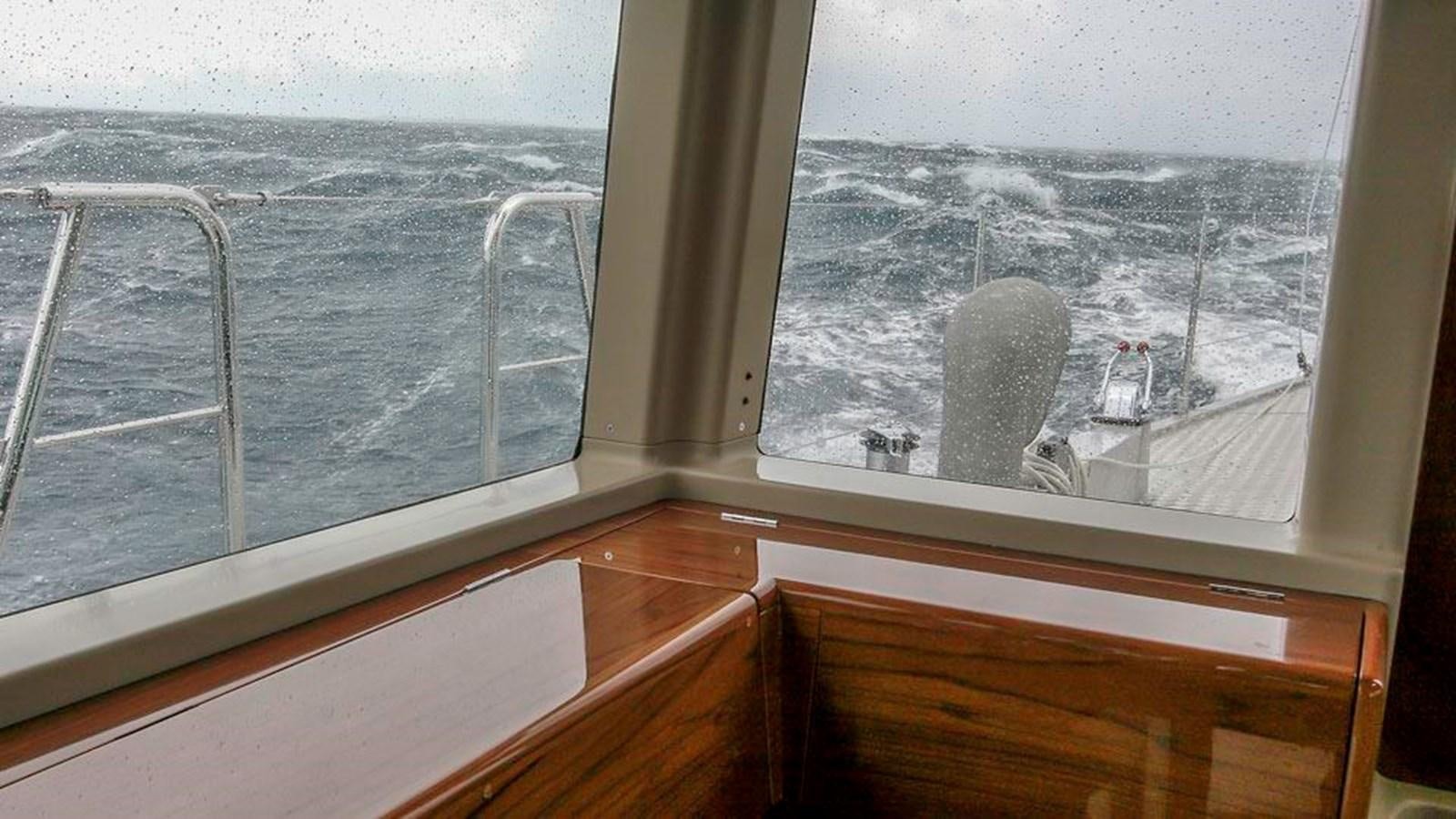 a window with a view of a city aboard WIND HORSE Yacht for Sale