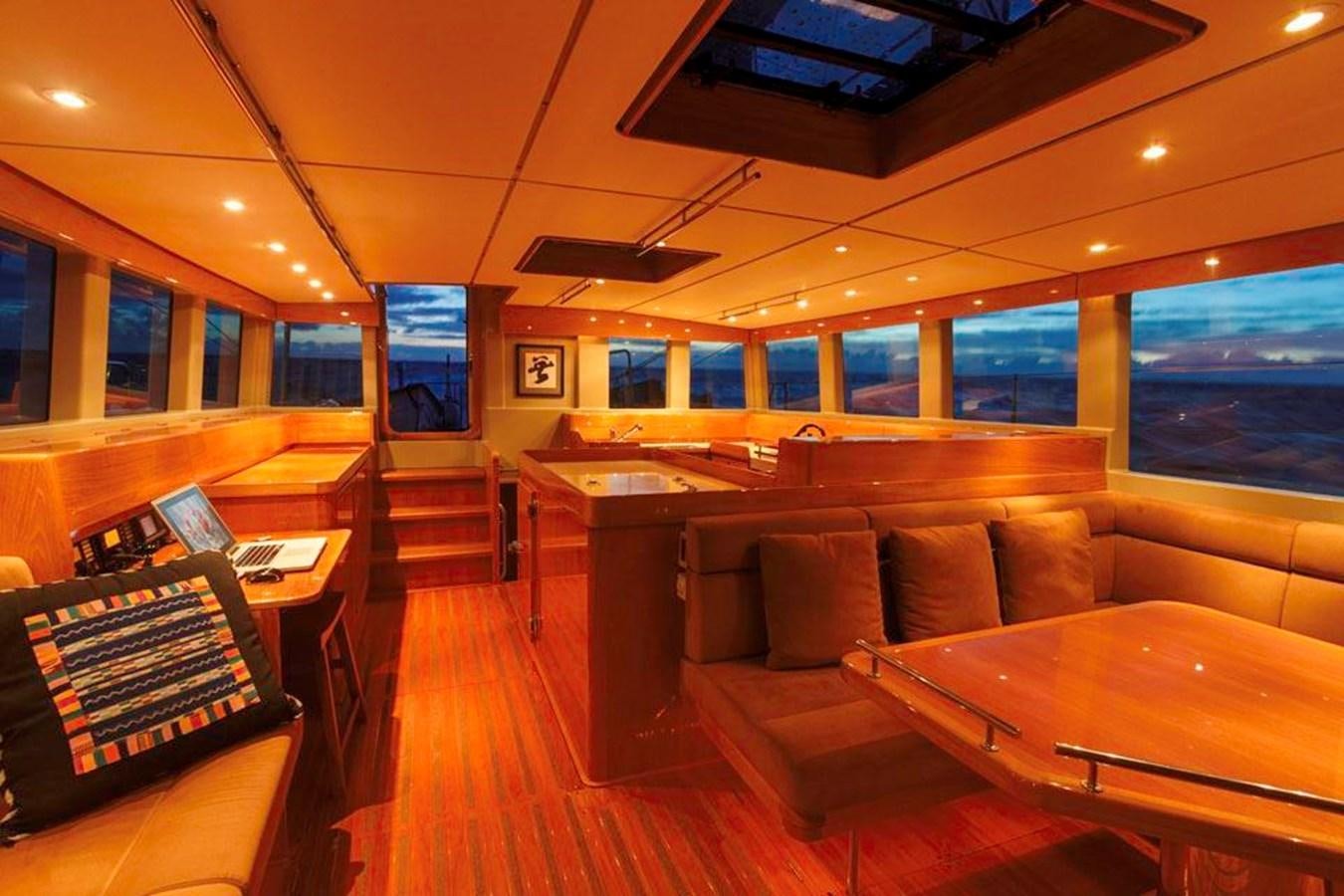 a living room with a couch and a table aboard WIND HORSE Yacht for Sale