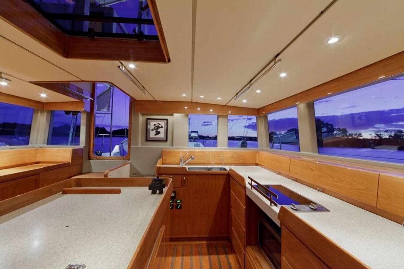 a room with a table and chairs aboard WIND HORSE Yacht for Sale