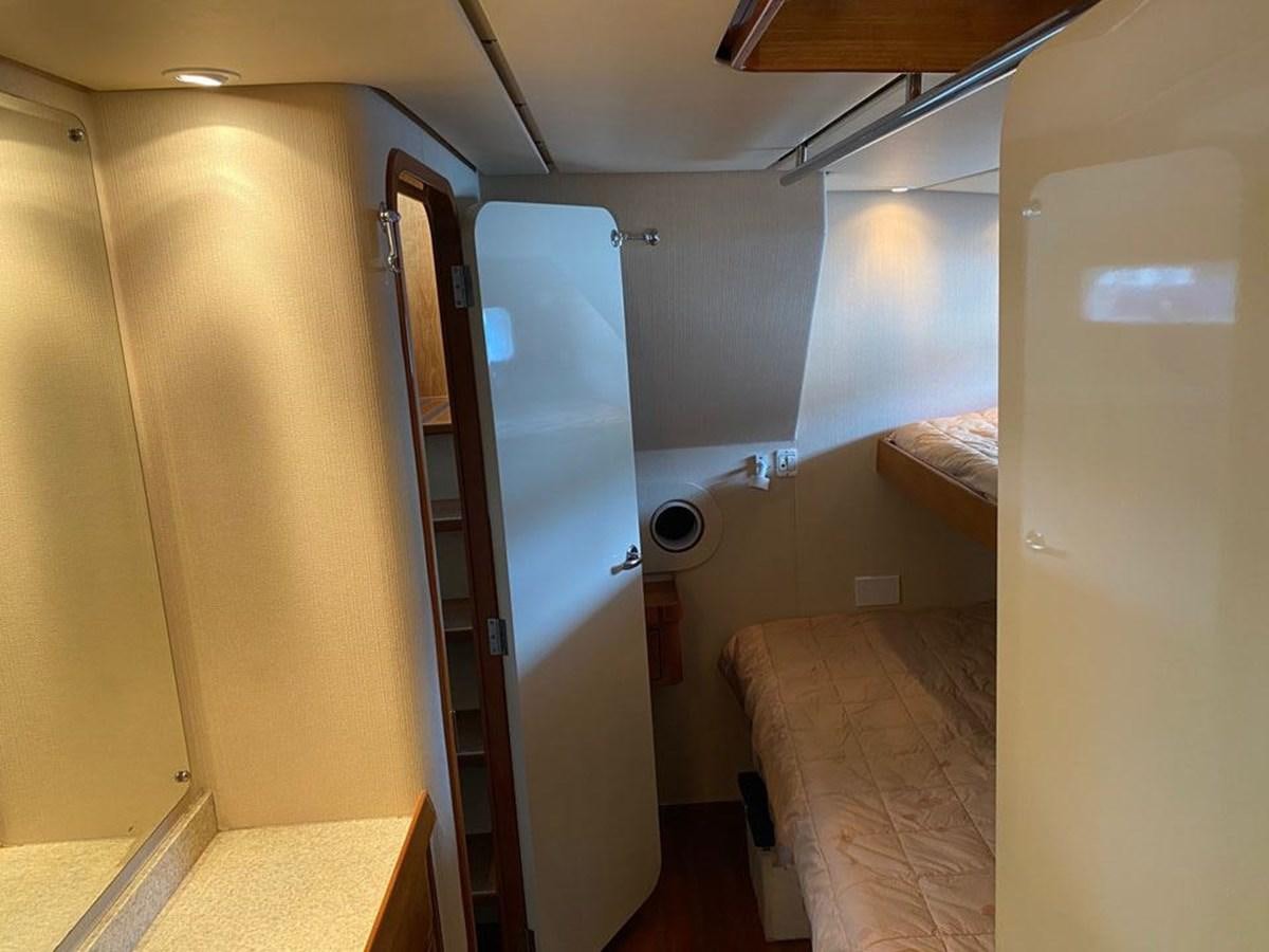 a room with a bunk bed and a ladder aboard WIND HORSE Yacht for Sale