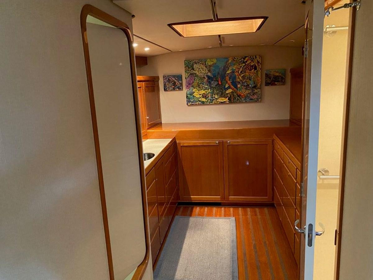 a hallway with wood cabinets aboard WIND HORSE Yacht for Sale