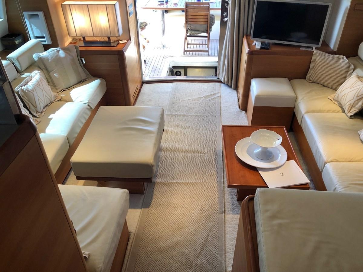 a room with a table and chairs aboard JULY Yacht for Sale