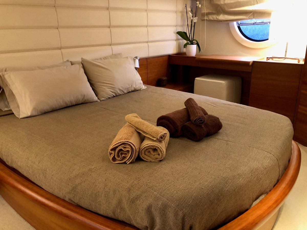 a bed with pillows and a pillow aboard JULY Yacht for Sale