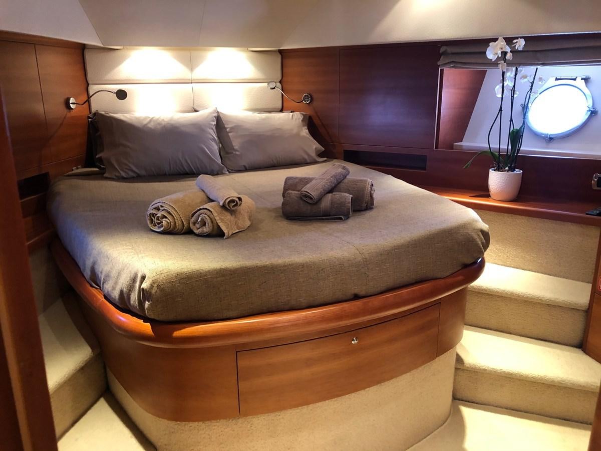 a bed with a large bed aboard JULY Yacht for Sale