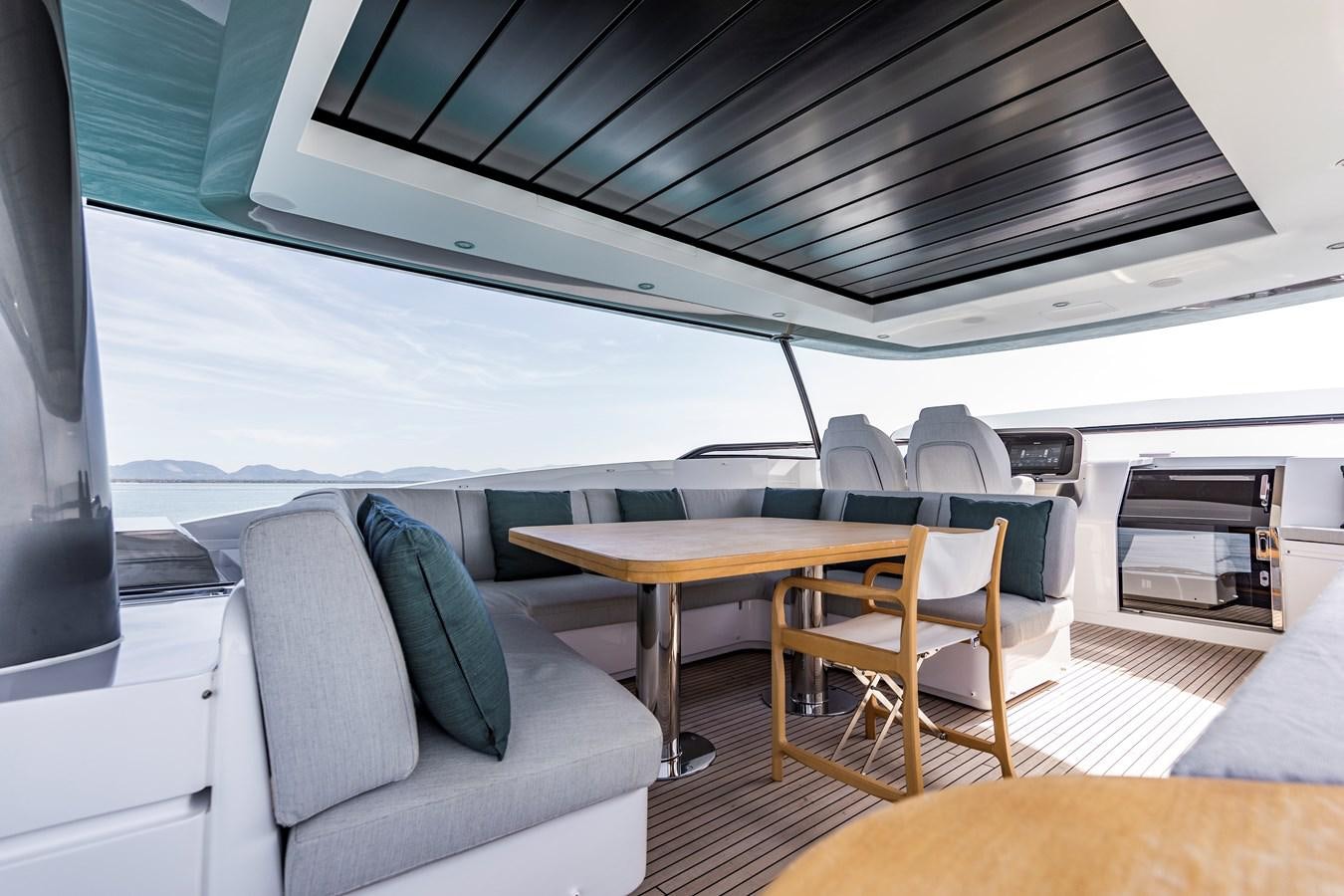 a boat with a table and chairs aboard ANDALA Yacht for Sale