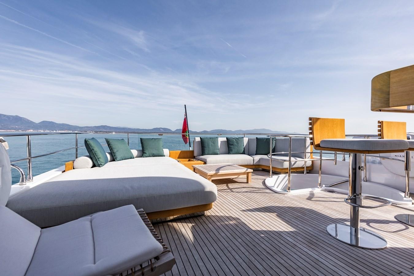 a room with a table chairs and a large body of water aboard ANDALA Yacht for Sale